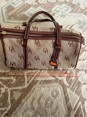 Dooney & Bourke Brown Monogram Barrel Bag with Maroon Trim